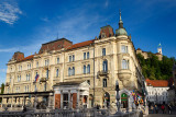 Kresija Building in the Old Town of Ljubljana Slovenia from the Triple Bridge over the Ljubljanica river with Ljubljana Castle H