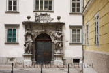 Entrance to the Ljubljana Theological Seminary Palace Library with two sculptures of Atlas flanking the door with motto Virtuti 