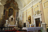 Interior sanctuary of Saint James parish Catholic church in Ljubljana Slovenia with altar and ornate tabernacle with carved ston