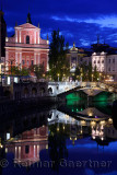 Franciscan Church of the Annunciation, Gallerija Emporium, Central Pharmacy, Triple Bridge reflected in Ljubljanica river Ljublj