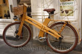 Environmentally friendly wood bicycle tied to a shop in the old town area of Ljubljana Slovenia