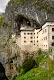 Cliff cave entrances at Predjama Castle 1570 Renaissance fortress built into the mouth of a cliffside cave in Slovenia