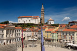 Elevated view of Tartini Square in Piran Slovenia with City Hall, St. George's Roman Catholic Cathedral with clock bell tower an
