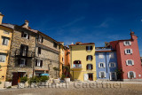 Colorful apartments at the Punta point of Piran Slovenia on the Adriatic sea coast near the lighthouse and Church of St Clement