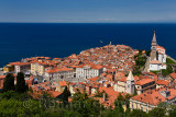 Cape Madonna at Point of Piran Slovenia on blue Adriatic Sea with Tartini Square courthouse City Hall and St George's Catholic c