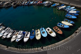 Horseshoe curved pattern of moored boats at the inner harbour of Piran Slovenia on the Adriatic Sea coast with green water
