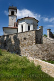 Stone wall and path to the catholic church of Saint Leonard with chain and belfry in Dolnje Cerovo Gorica Hills Brda Slovenia