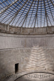 Abstract view of a central tower door with skylight and names of the interred dead at the World War I memorial in Oslavia Italy