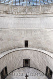 Central tower with skylight cross and names of the interred at the World War I memorial at Oslavia Italy