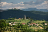 View of Church of the Holy Cross and Sveta Goro Holy Mountain with Basilica of the Assumption of Mary from Smartno Brda Slovenia