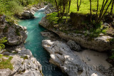 Turquoise water and smoothed karst limestone of Soca river in Spring Trenta Valley Triglav National Park Slovenia at Vrsnica Gor