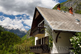 Three star apartment guest house in alpine village of Trenta with snowy Srebrnjak Peak in Triglav National Park Julian Alps Slov