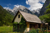 Garden shed in Trenta Slovenia with Pihavec and Triglav mountain peaks in Triglav National Park Julian Alps in Spring
