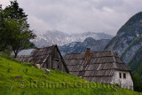 Old Trenta houses at the Turer farmstead in Trenta Valley in Triglav National Park with Veliko Spicje peak in Julian Alps at dus