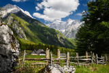 High alpine farmstead in Zadnja Trenta Valley with view of Prisojnik and Razor Peaks in Triglav National Park Julian Alps Sloven