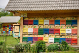 Colorful traditionally painted apiary beehive houses at Kralov Med in Selo near Bled Slovenia with Spring garden