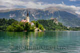 Assumption of Mary pilgrimage church Beld Island Lake Bled with Bled castle on cliff and St Martin church Sol massive of Karavan