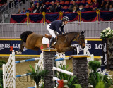 Andrew Kocher riding Quarto Mail over oxer at the McKee Family International Jumper Competition at the Royal Horse Show Ricoh Co