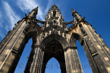Looking up to the soot stained stones of the Sir Walter Scott Monument of Victorian Gothic architecture in Edinburgh Scotland UK