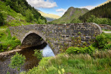 Ancient stone military bridge Eas-Nan-Arm over the river Shiel in Glen Shiel Kintail Scottish Highlands Scotland UK