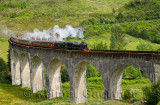 Heritage Jacobite coal fired Steam Train Hogwarts Express used in Harry Potter films at Glenfinnan viaduct in the Scottish Highl