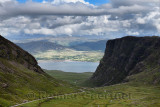 Road up to Bealach na Ba mountain pass with Loch Kishorn and Sgurr A Chaorachain and Meall Gorm mountains in Scottish Highlands 