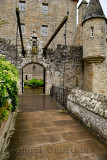 Front of Cawdor Castle with turret and drawbridge with bell and Stags Head Buckel Be Mindfull emblem in the rain Cawdor Nairn Sc