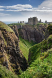 Cliffs at Burn of Halymyres stream leading to Donnottar Castle 13th Century ruins near Stonehaven Scotland UK