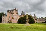 Front lawn of Glamis Castle childhood home of Queen Mother with wild Ring-necked Pheasant and The Great Sundial Scotland UK
