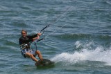Kite boarder slicing the water