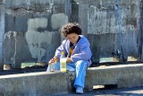 Having A Snack While Fishing On The Sea Wall