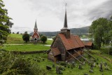 The new Rdven Church (L) and the old Rdven Stave Church (R)