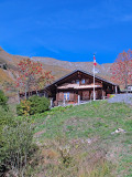 An alpine chalet seen from the train