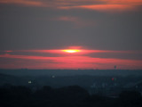 The early morning sun disappears into the clouds