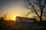 Sunset behind barn