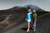 Mount Etna - Aneta and Alex on Torre del Filosofo 2920m, the central craters 3340m behind, Etna NP