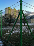 Green Fence And Building