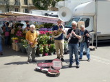 Group playing music at the market