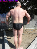 backyard man flexing.jpg