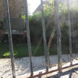 Fence with bullet dents