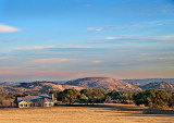 Distant view with ranch house in foreground 