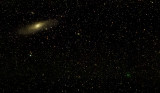 Comet 64P/Swift-Gehrels and the Andromeda Galaxy (M31)