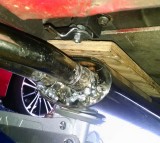 Steadying the muffler - for tailpipe insertion or removal
