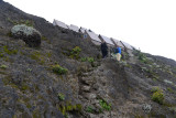 The fifth and final stage of the climb, a steep scramble up to the craters rim