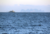 HTMS Narathiwat (OPV 512 on the horizon with Koh Phi Phi Let