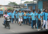 Religious procession of young people along the road between Dili and Tasi Tolu