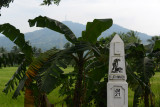 Bataan Death March route km marker with Mount Samat
