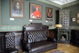 Leather sofa and ceramic fireplace with portraits, Nesvizh Castle