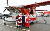 Flying Santa and Mrs Claus in Bad Kitty Kodiak Quest airplane 150a