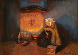 Young fishers woman at the open fire.